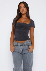 Detail shot of a dark grey square neck short sleeve top featuring ruched chest texture