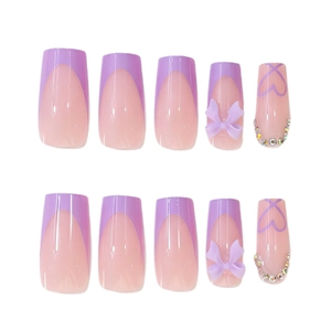 Purple French coffin press-on nails with 3D bows and heart patterns on white background
