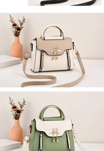 Close-up of elegant handbags with swan metal clasps and pearl charms in beige and green