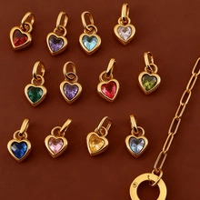 Detailed view of colorful heart-shaped crystal pendants on a luxury gold-plated chain