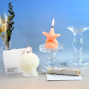 Bougies parfumées coquillage et étoile de mer sur support en verre décor océanique
