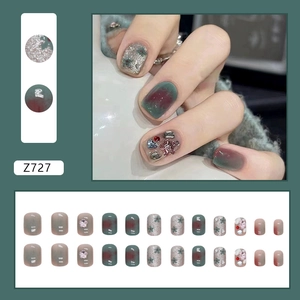 Short agate green press-on nails with marble ink patterns and 3D diamond flower accents