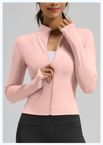 Detailed view of women's slim fit yoga jacket in pale pink with full zipper and stand collar