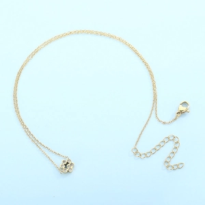 Detail of gold floral pendant necklace with crystal inlay and adjustable lobster clasp
