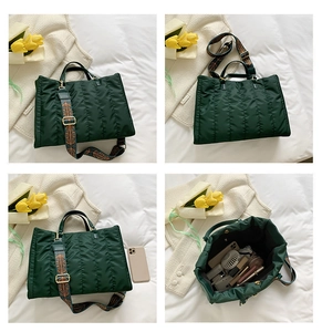 Detail view of large quilted tote bag featuring a floral jacquard wide strap and spacious interior