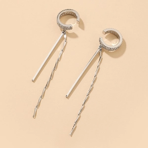 Close-up of silver C-shaped cuff earring with cubic zirconia and long tassel details