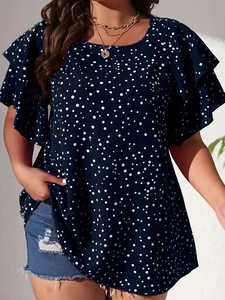Navy blue polka dot ruffle sleeve blouse styled with denim shorts for a casual summer look