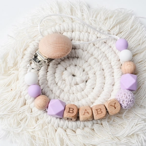 Beech wood pacifier clip with purple silicone beads and BABY engraved wooden squares