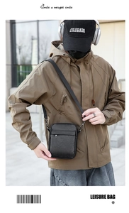 Detail of a minimalist black PU leather crossbody bag with adjustable strap for urban style