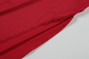 Detailed close-up of side pocket and high-quality stitching on a red summer dress