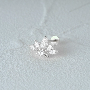 Macro shot of silver cartilage stud with marquise zircon stones and a flat back