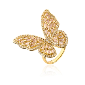 Detail of butterfly ring with pink square zircons and white crystals in gold plating