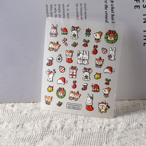 Detailed macro view of 5D Christmas Bunny embossed nail stickers with cartoon motifs