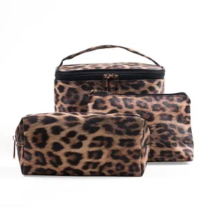 Three-piece set of leopard print makeup bags including vanity case and zipper pouches