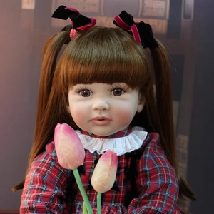 Realistic 60cm reborn toddler doll with brown pigtails in a red plaid lace dress