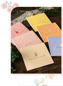 Close-up of assorted 3D floral greeting cards with elegant patterns and phrases