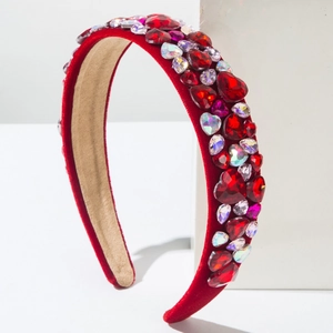 Close-up of red velvet headband featuring sparkling colorful heart rhinestones and soft lining