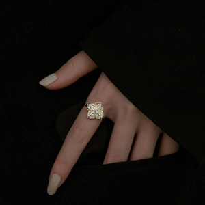 Rotating four-leaf clover ring with marquise-cut cubic zirconia in gold plating