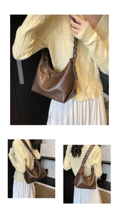 Close-up of brown hobo bag featuring a unique decorative linked strap and zip closure