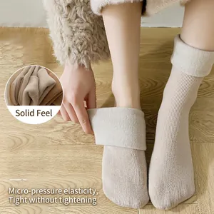 Fleece lined thermal snow socks for women with thick knit texture and fold-over cuff