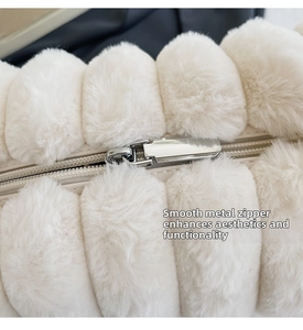 Detail of soft white faux fur bag with a premium silver metal zipper closure
