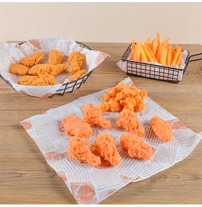 Realistic fried chicken legs and fries in a wire basket with vintage newspaper liner