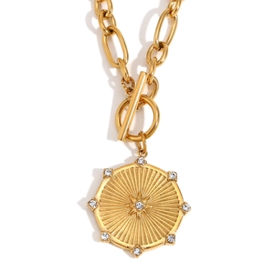 18K gold plated stainless steel necklace with starburst disc pendant and OT toggle clasp