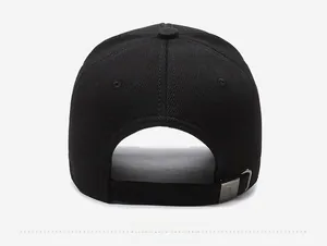 Detail of adjustable back strap on black baseball cap with matte silver metal buckle