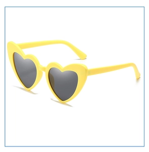 Detailed view of yellow heart-shaped sunglasses with dark lenses and sturdy metal hinges