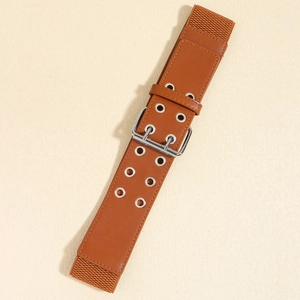 Detail of a brown elastic wide belt featuring double-row silver eyelets and a metal buckle