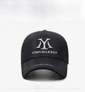 Detail of black breathable mesh baseball cap with white YM embroidery and curved brim