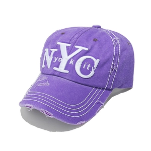 Detail of purple distressed canvas baseball cap featuring white NYC 3D embroidery