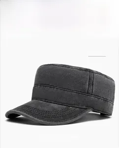 Detail of a vintage washed black cotton cadet cap with decorative stitching on the brim