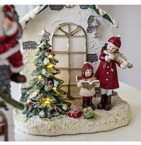 Detailed Christmas resin scene with miniatures, LED tree and carolers on snowy base