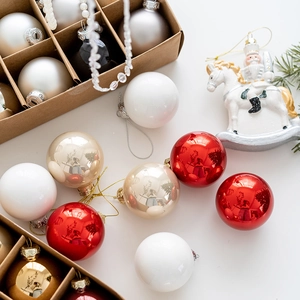Assorted 6cm Christmas balls in red, gold, white, and black with nutcracker ornament