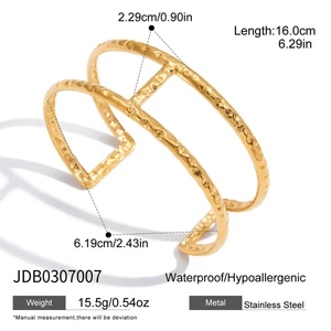 Detailed view of 18K gold plated hammered texture double-row cuff bracelet with specs