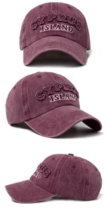 Detail of vintage washed cotton baseball cap with Cyprus Island 3D embroidery textures