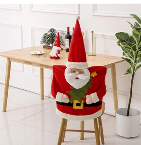 Detail of plush Santa Claus chair cover with red hat and black belt for Christmas decor