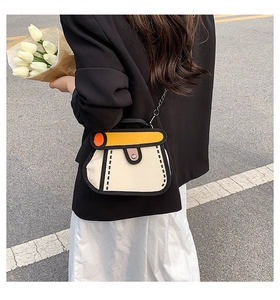Close-up of a 2D cartoon style yellow and white canvas bag with a black chain strap