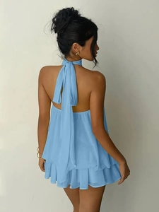 Detail of light blue chiffon halter neck mini dress with an open back and tie straps