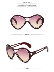 Detail view of large jujube red hollow frames with purple yellow gradient lenses