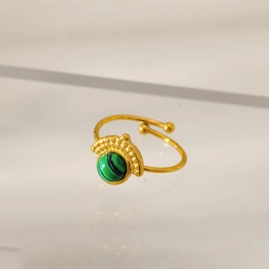 Detail view of gold-plated stainless steel ring with green stone and beaded accents