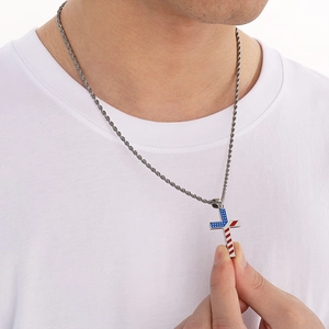 Detail of man wearing a stainless steel cross necklace with American flag star pattern