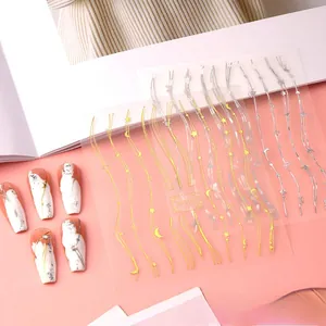 Detail of TH-0162 nail stickers featuring gold waves and celestial star moon patterns