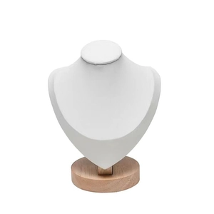 Detail of white leather bust jewelry display with round solid wood base for necklaces