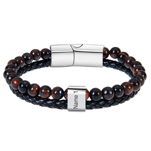 Detail of tiger eye beads and braided leather cord with custom engraved name magnetic clasp