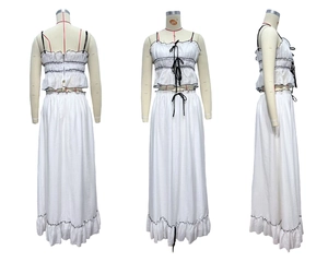 Close-up of white two-piece set featuring pleated texture and black ruffled edges
