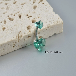 Macro shot of silver heart zircon navel ring on stone showing size 1.6x10x5x8mm