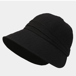 Chic black foldable bucket hat for women with textured fabric for sun protection