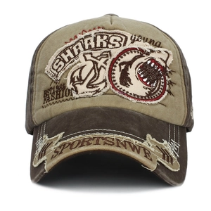 Detail of vintage washed cotton baseball cap with Sharks embroidery and distressed elements